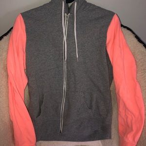 Gray hoodie with neon peach sleeves
